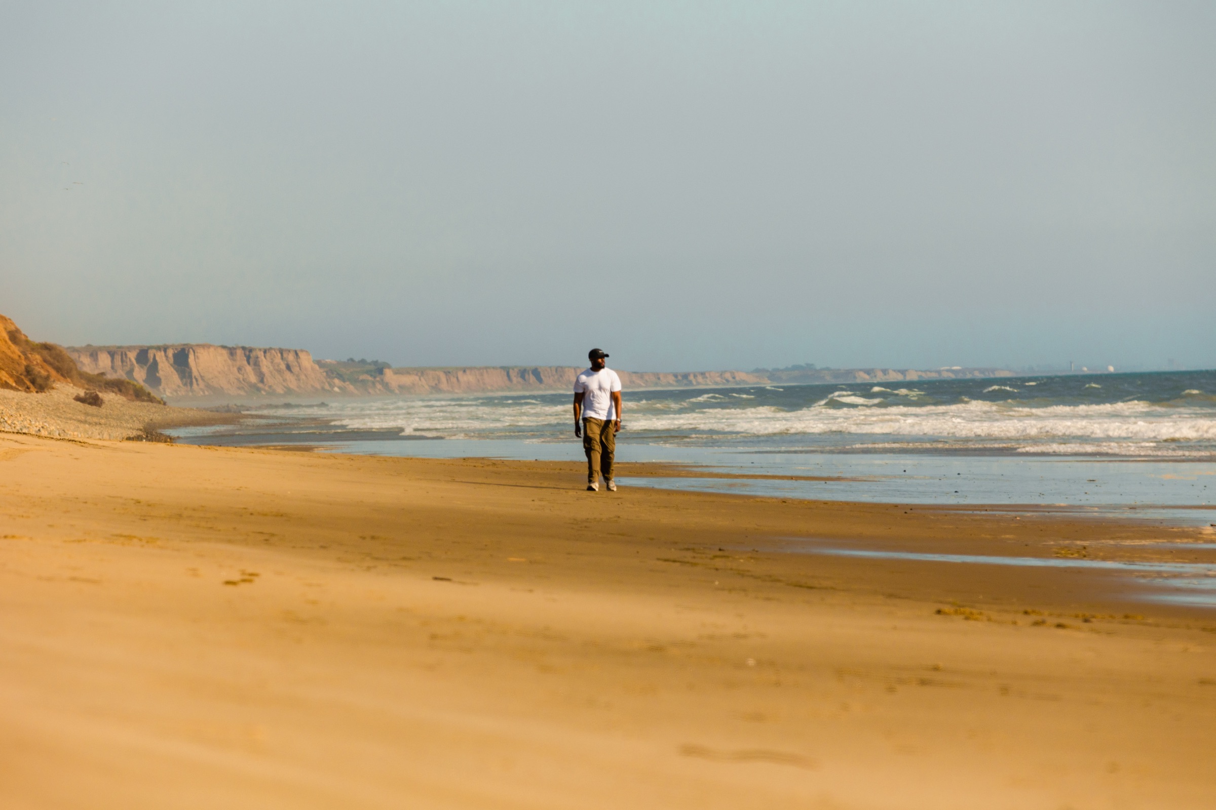 Davon walking a wild stretch of coastline during the pilot shoot
